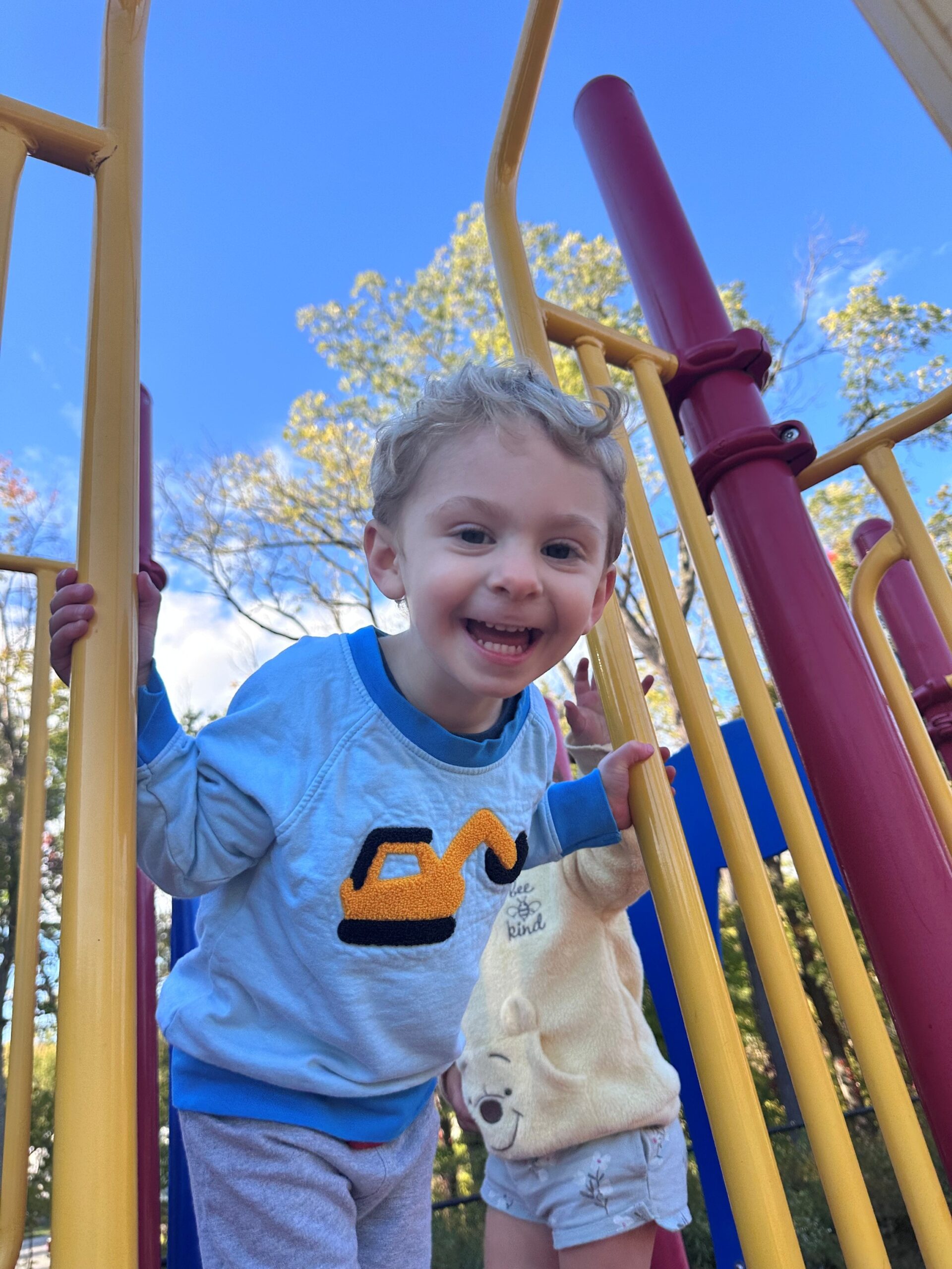 Atlas Smiling And Happily Playing On Playground.