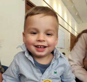 Toddler boy smiling.