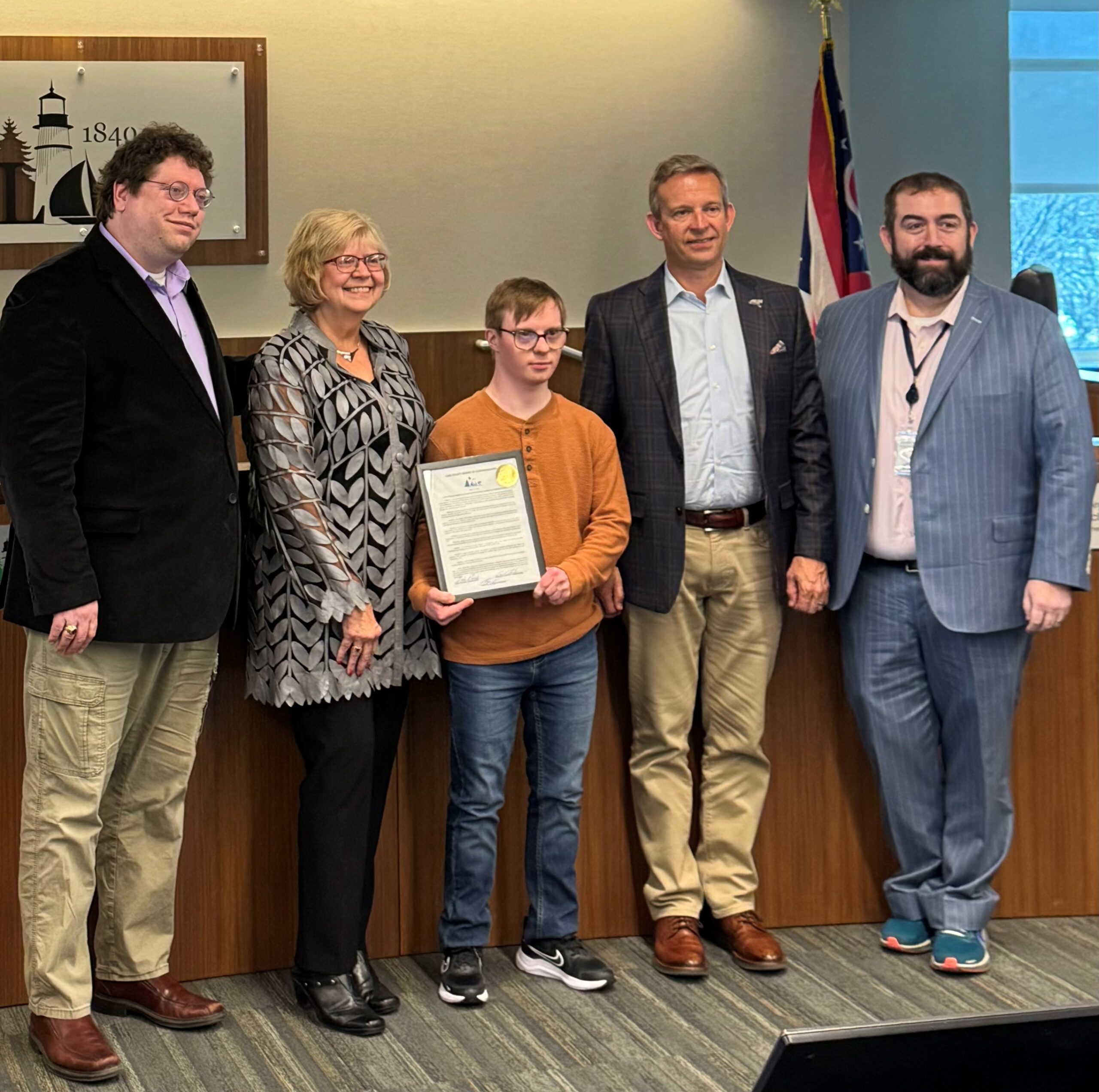 LCBDD Superintendent Elfie Roman And Sam Majoros Standing With Lake County Commissioners John Plecnik, Morgan McIntosh, And Morris Beverage III At The Lake County Commissioners Meeting 3-12-2026 For Developmental Disabilities Awareness Month.